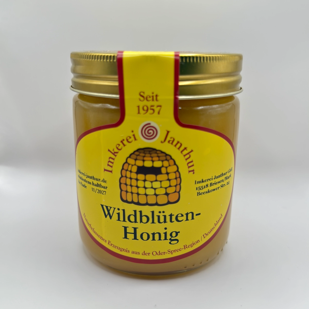 Glas Wildblütenhonig der Imkerei Janthur vor weißem Hintergrund
